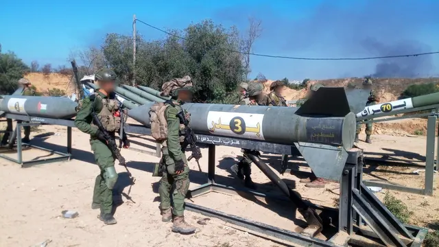 IDF soldiers near Badr-3 rockets at an outpost in northern Gaza in November 2023