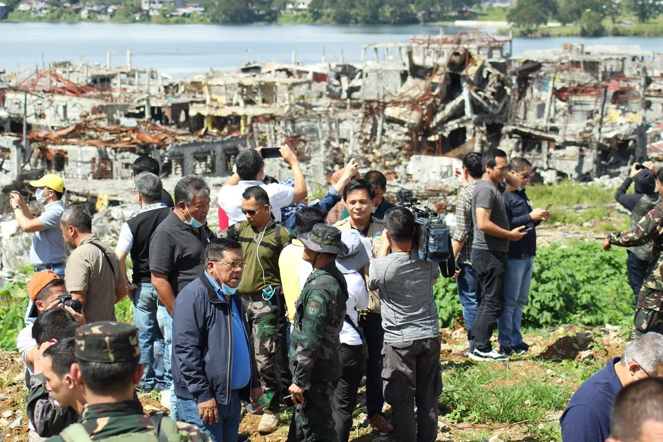 Local officials visiting Marawi's main battle area after the battle.