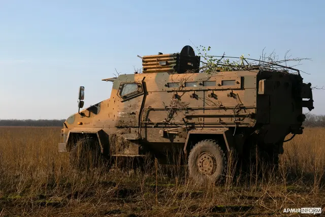 Ukrainian marines standing near BMC Kirpi MRAPs