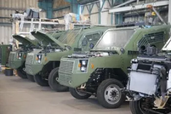 Armored vehicles inside a Gaia-supported production line