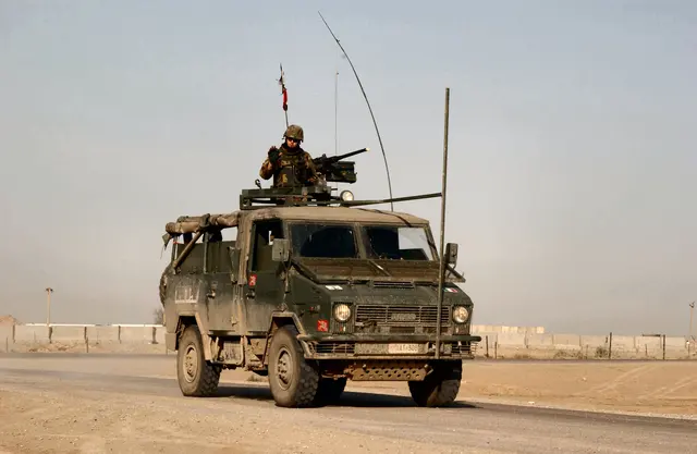 Italian personnel aboard an Iveco 40.10WM light truck at Tallil Air Base in Iraq
