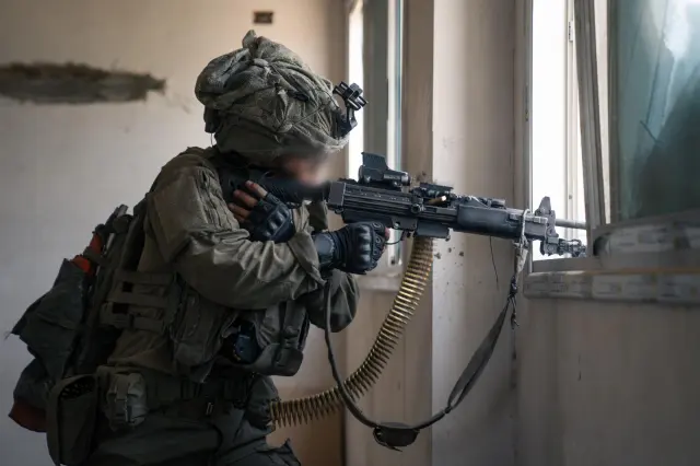 IDF Golani Brigade soldier firing an IMI Negev 5 in Gaza in 2025