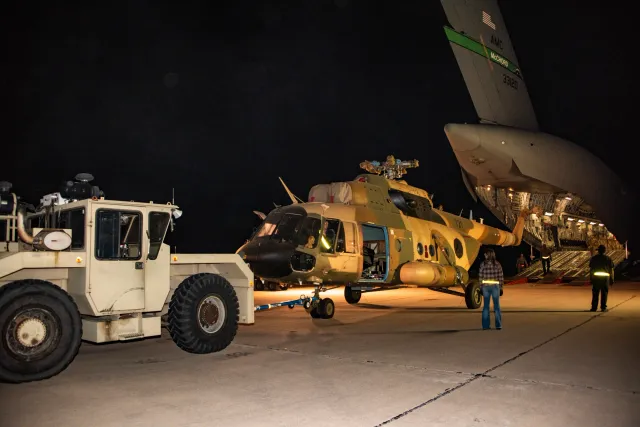 Mi-17 helicopters being prepared for air transport at Davis-Monthan Air Force Base