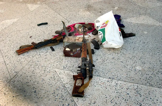 Captured AK-47, Dragunov sniper rifle, and ammunition found outside Khowst, Afghanistan