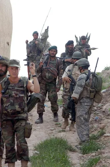 U.S. Special Forces soldier advising Afghan National Army soldiers in Helmand Province